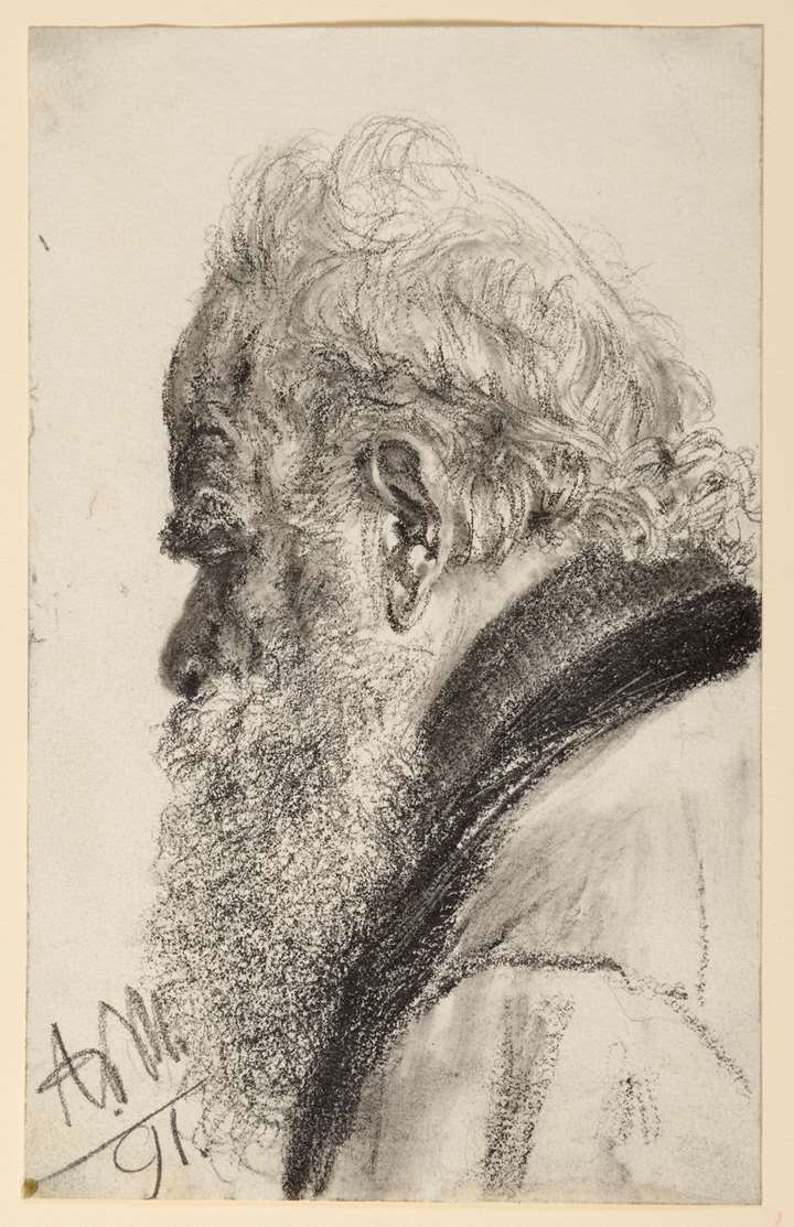 A Bearded Man Looking Down to the Left